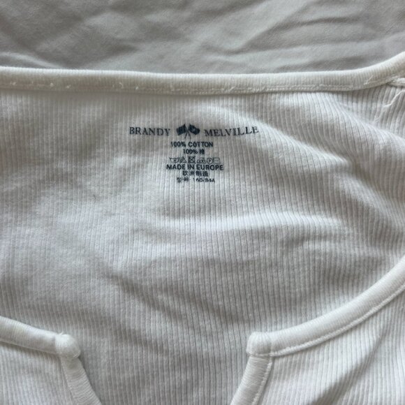 Brandy Melville white v-neck tee. Super cute and flattering.In perfect condition - Picture 2 of 2